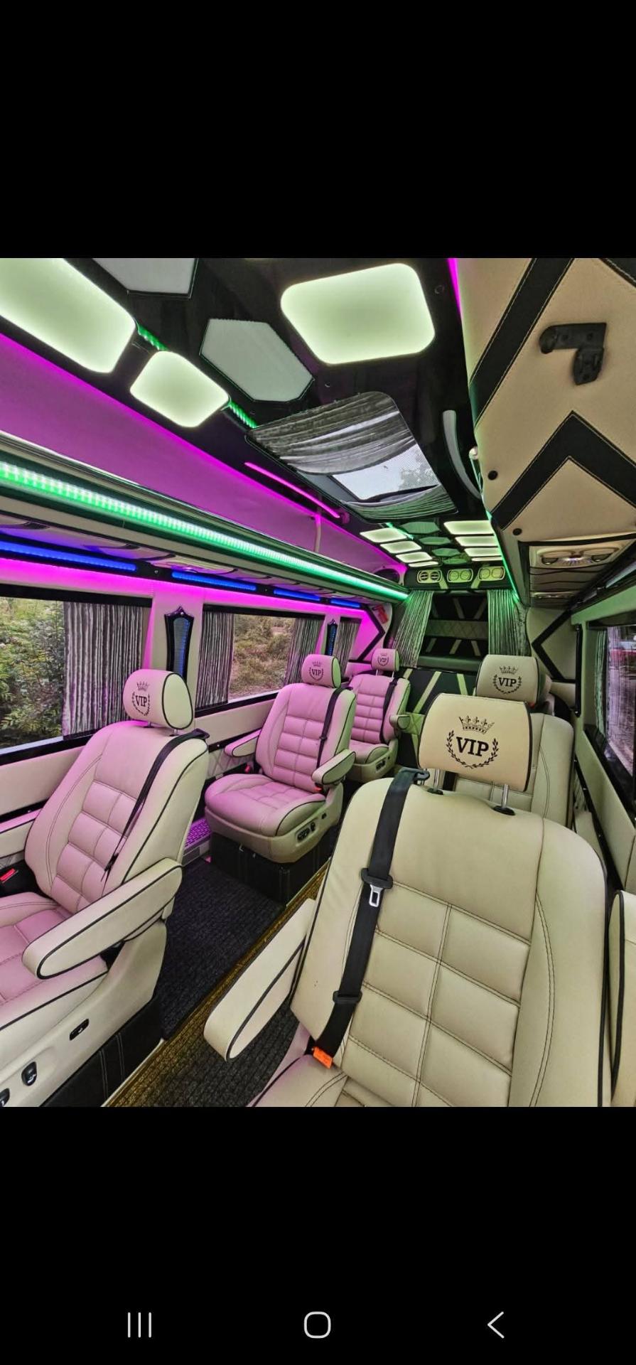Interior of the VIP transfer bus with leather seats and LED lighting